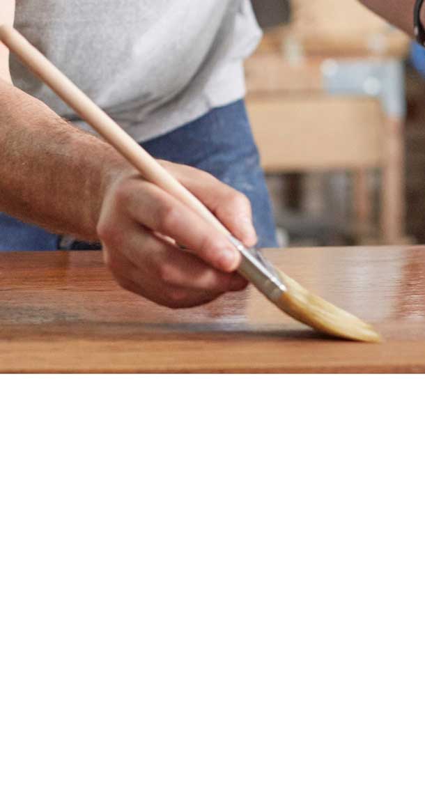 putting clear varnish on a table top
