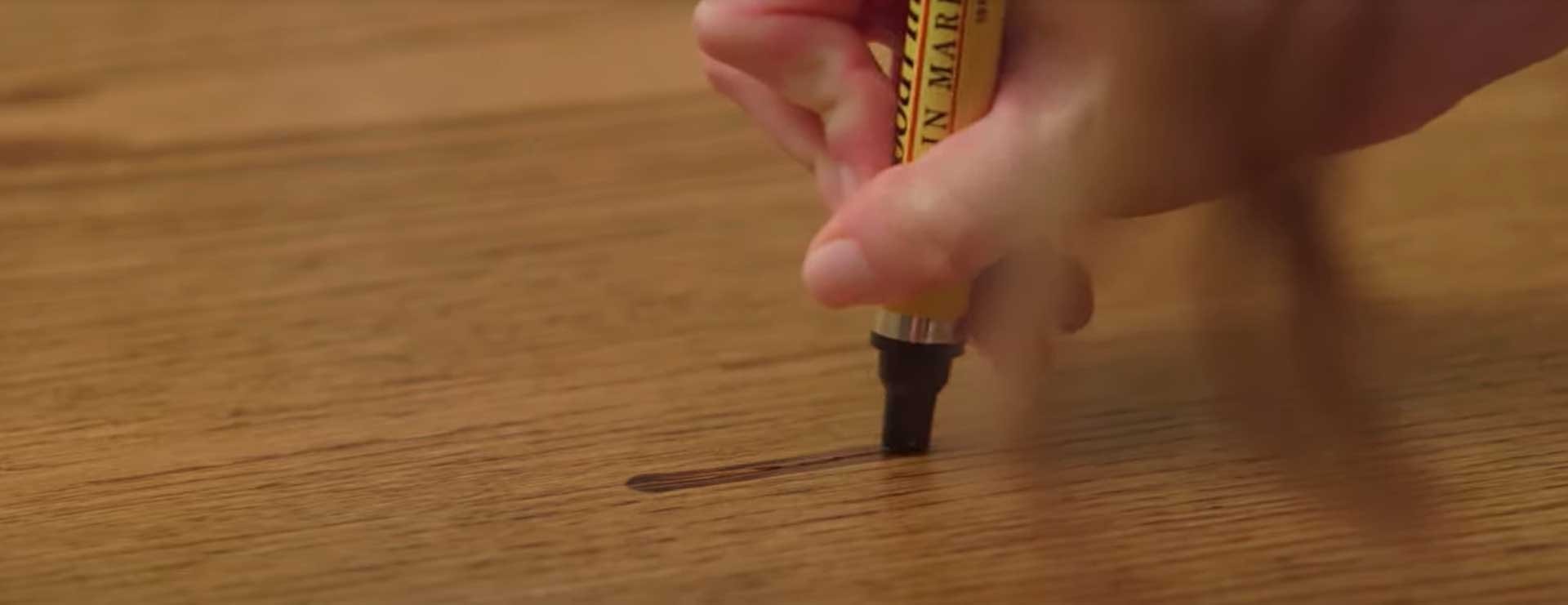 fixing scratch with a stain marker