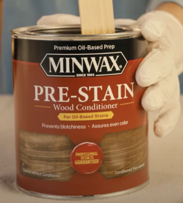Stirring a can of Minwax Pre-Stain